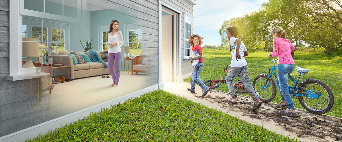 woman in clean living on stain-resistant carpet, kids outside with muddy bikes