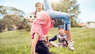 three children dirty from playing outside